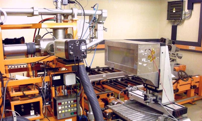 Setup for irradiation with protons. The beam pipe (left) and a coolable box in which the objects to be irradiated are secured can be seen.